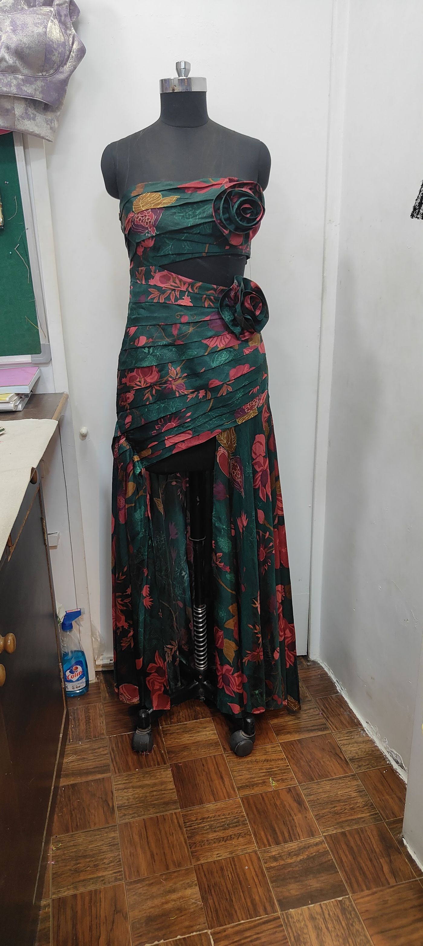 A hand-finished floral gown on a mannequin at Fusion Tailoring's Bandra West workshop